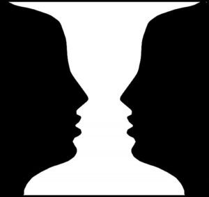 2 black face on white page facing each other or you can also see a while vase on black page (2 images on same picture)