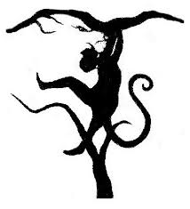 black and white picture of a person swinging in a tree or a lion face