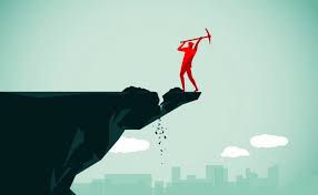 red person cutting edge rock and will fall off